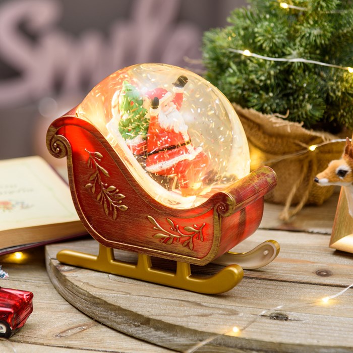 Slitta decorata con Babbo Natale a batteria con glitter nell'acqua